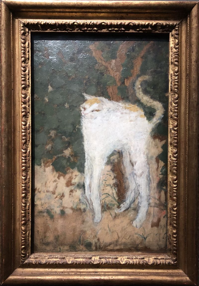 the painting le chat blanc in a golden frame